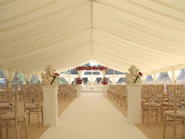 Luxury-draped-event-tent-solution-accommodating-complex-cultural-wedding-decor-and-aisle-arrangements