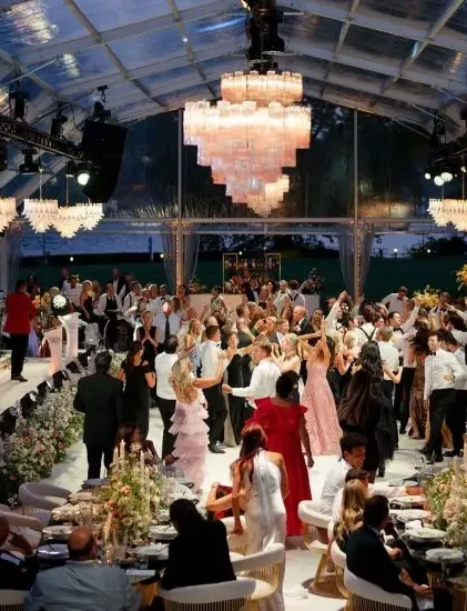 Clear roof aluminum event tent hosting an elegant banquet overlooking a vineyard.